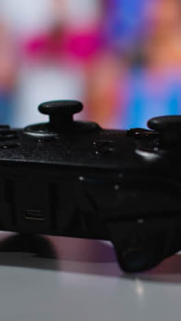 Vertical-Video-Close-Up-Macro-Video-Game-Controller-Sports-Game-Screen-Background